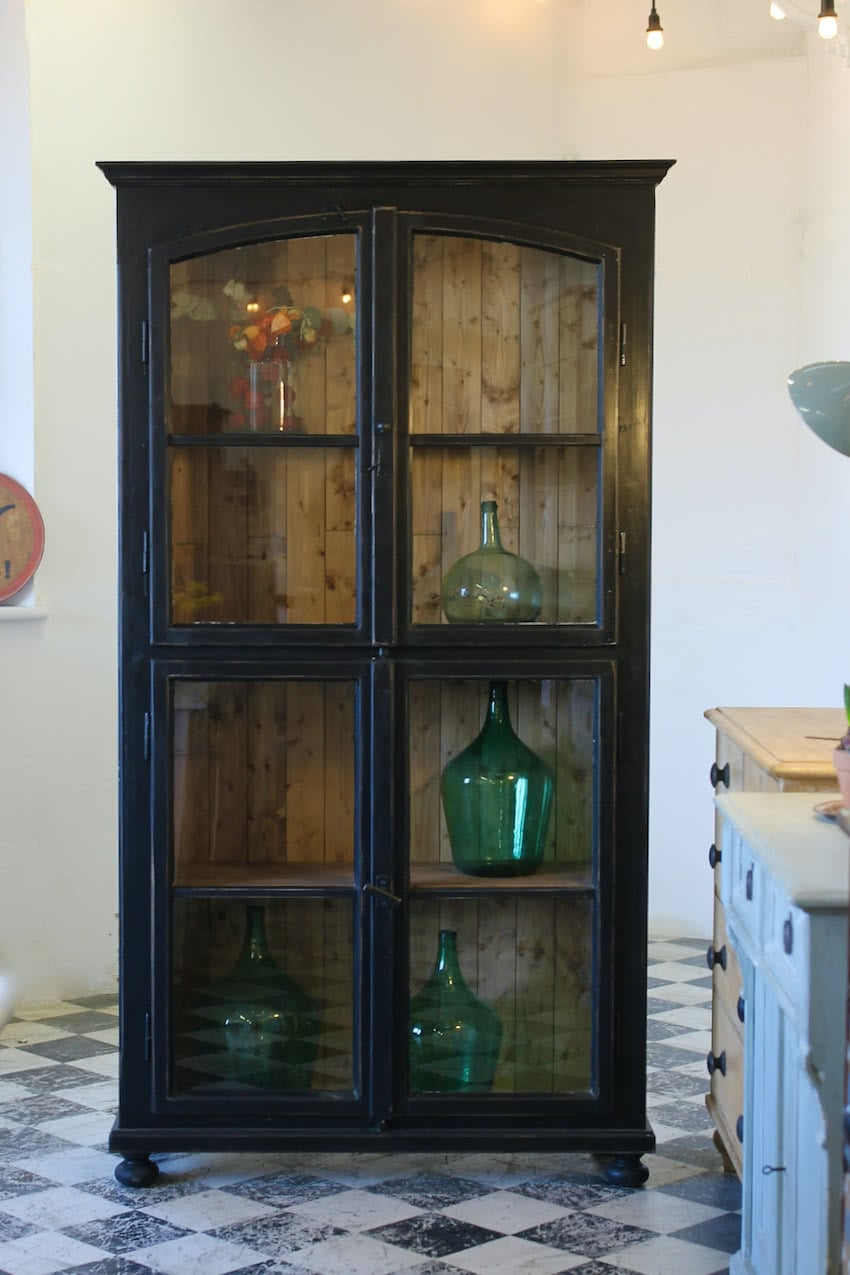 tall glazed cupboard with old factory glass doors