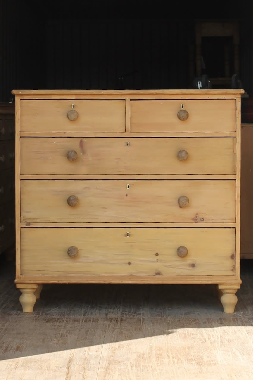 large english pine antique chest of drawers with contrasting black knobs