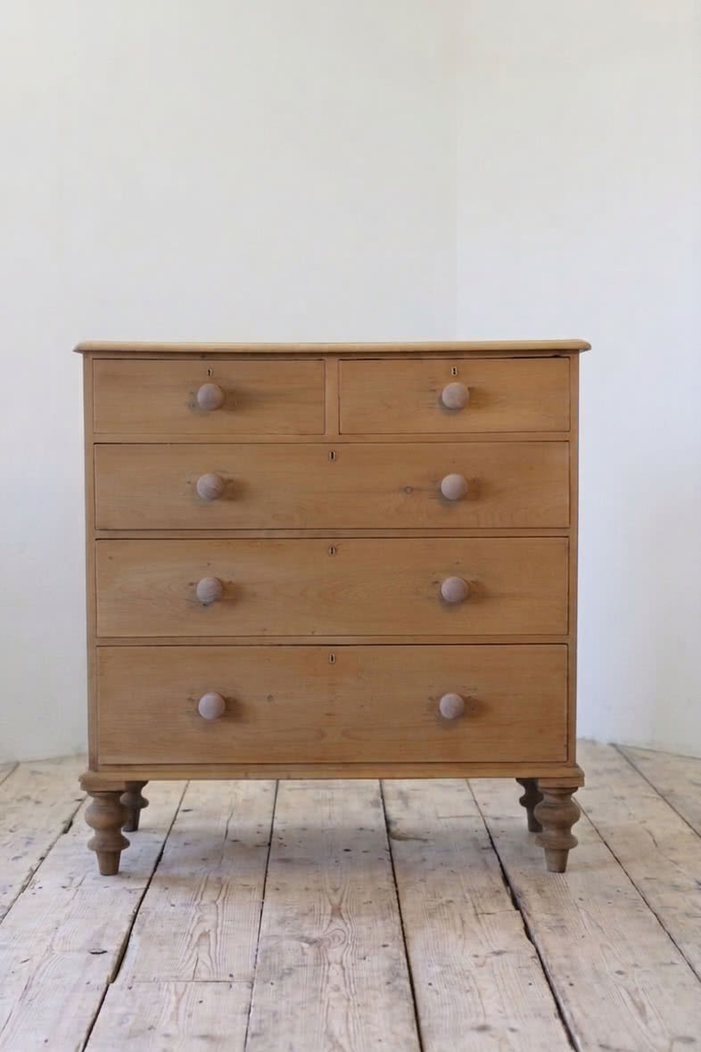 gorgeous looking antique english pine chest with new knobs and original feet, a very solid large chest of drawers.