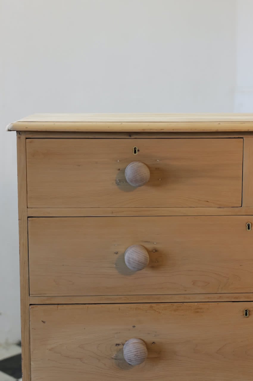 gorgeous looking antique english pine chest with new knobs and original feet, a very solid large chest of drawers.